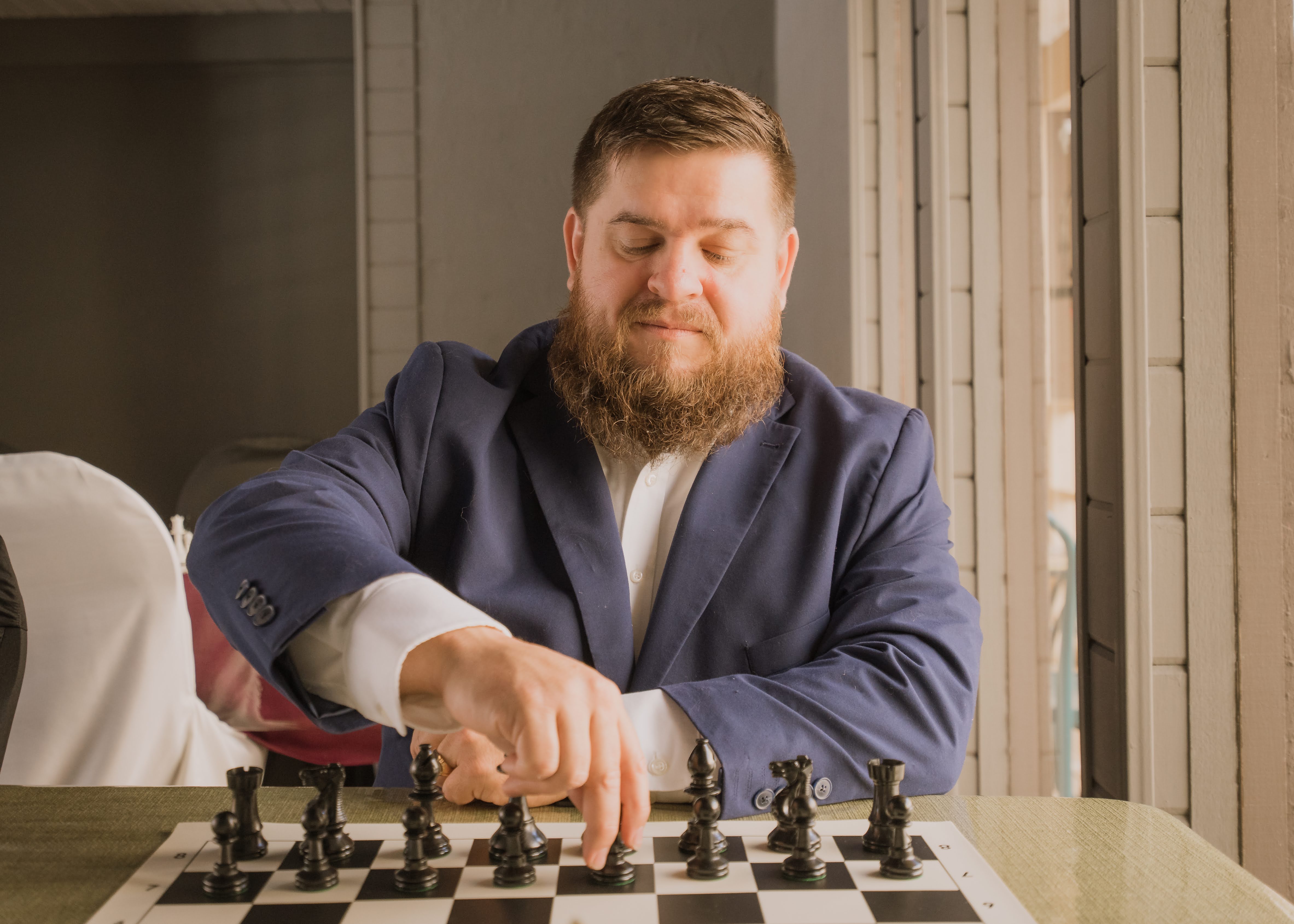 Coach JB Justin Bradley playing chess at Carmel Valley Chess Club