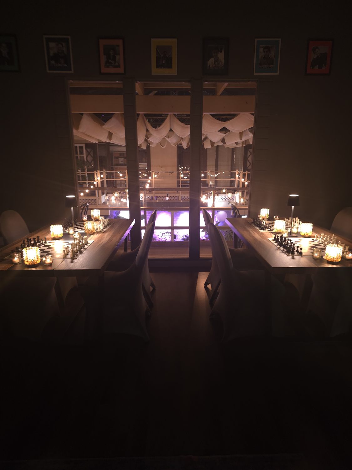 The Carmel Valley Chess Club room set with candlelit boards for the evening